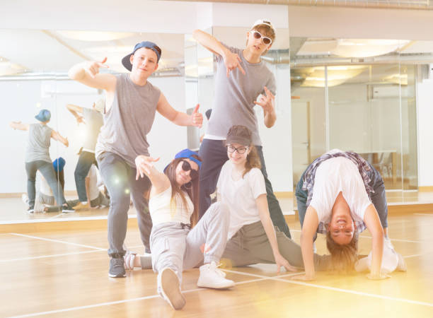 istock Group of dancing teenagers posing in dance studio 1328531016