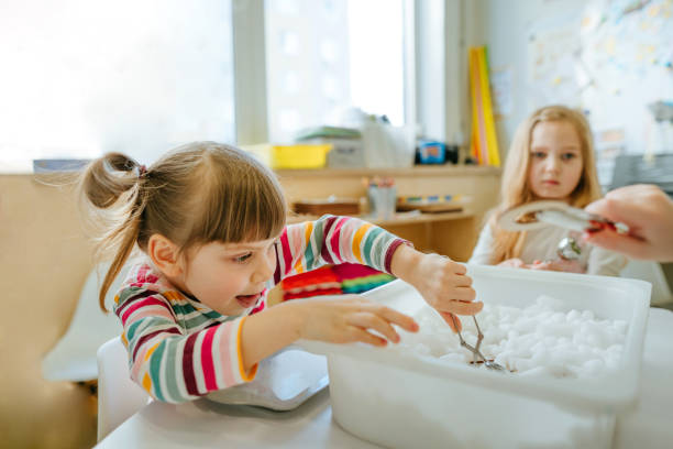 istock Learning play activities in kindergarten or daycare centre 1328535743