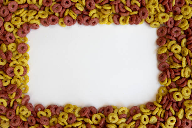 delicious cheerios oat cereal in large pile, cereal cheerios background, delicious and useful breakfast, frame with rings breakfast cereal
