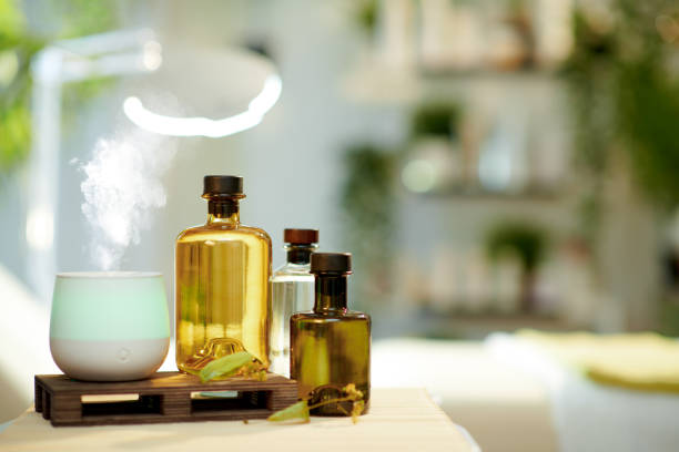 istock aroma lamp, essential oils and massage table in beauty studio 1328536041