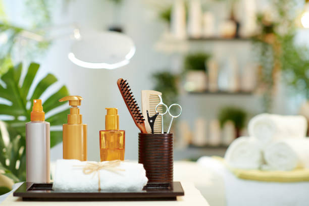 towel and hair care products in modern beauty studio stock photo