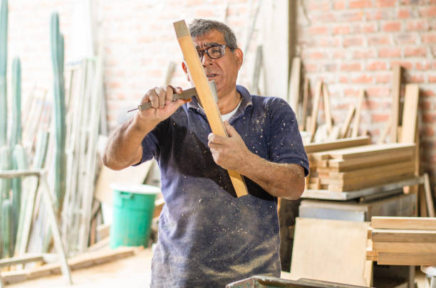 istock The elder or senior learn new skills, Learn to become a carpenter. 1328537146