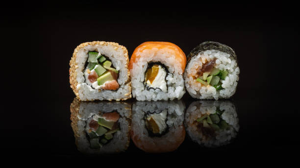 istock Set of sushi and maki rolls on the glass table 1328537191