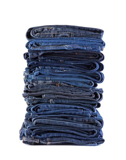 istock Stack of blue jeans isolated on white background with clipping path 1328538581