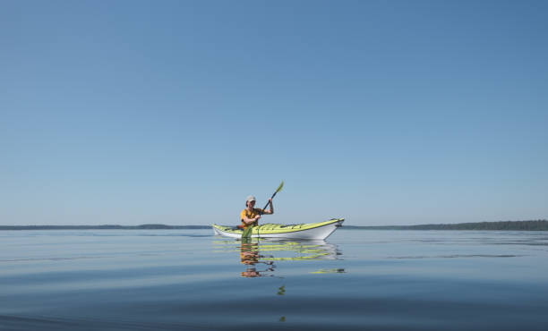 istock Kayaking in calm water on a sunny clear day 1328541908