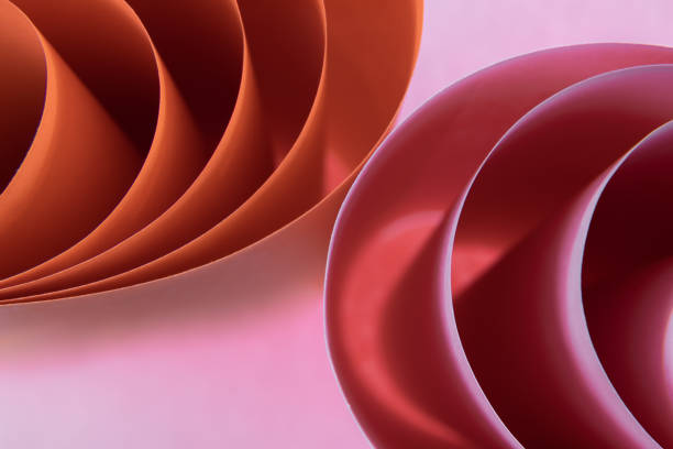 istock Abstract orange and pink colored background with curved lines and shapes 1328545331