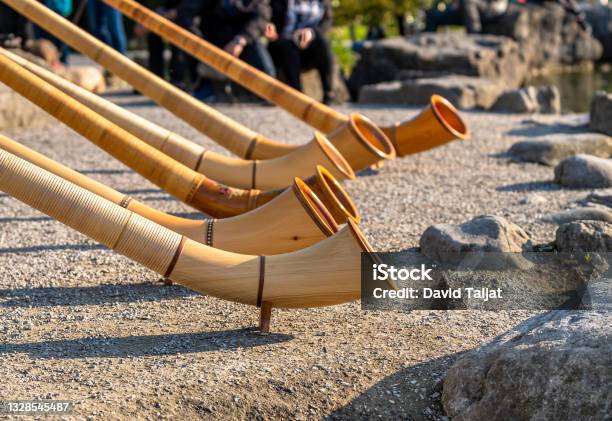 The Alpine Horn Ensemble Performing In Swiss Werdenberg Stock Photo - Download Image Now
