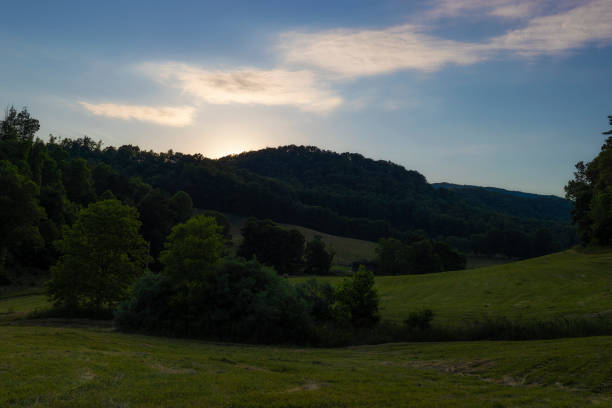 Sun slides behind the hills late summer evening in Northeastern Tennessee