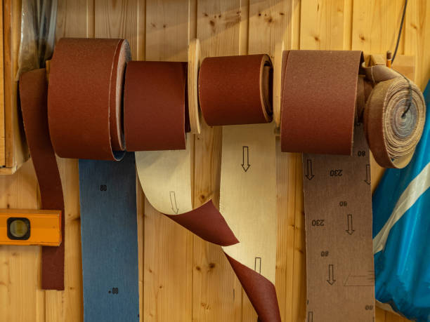 istock Carpentry workshop. Sandpaper rolls for sanding wood surfaces. 1328547199