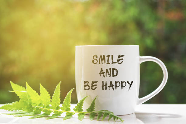 istock Smile and be Happy Inspirational Quotes on Coffee Mug 1328548074