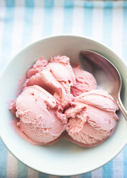istock Strawberry ice creams scoops in blue bowl 1328549046