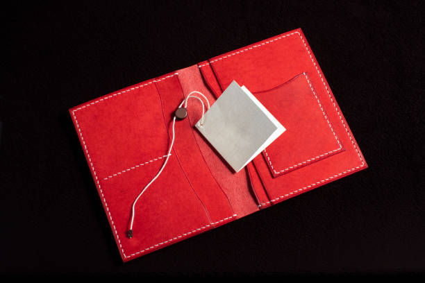 istock Open leather red purse with pockets on a dark background. 1328549117