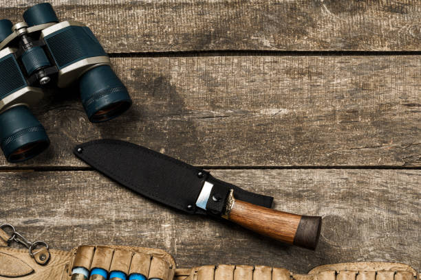istock Various hunting equipment on old wooden background 1328549513