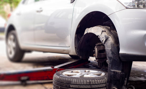 istock Changing of a mud splash guard at the car service 1328550727