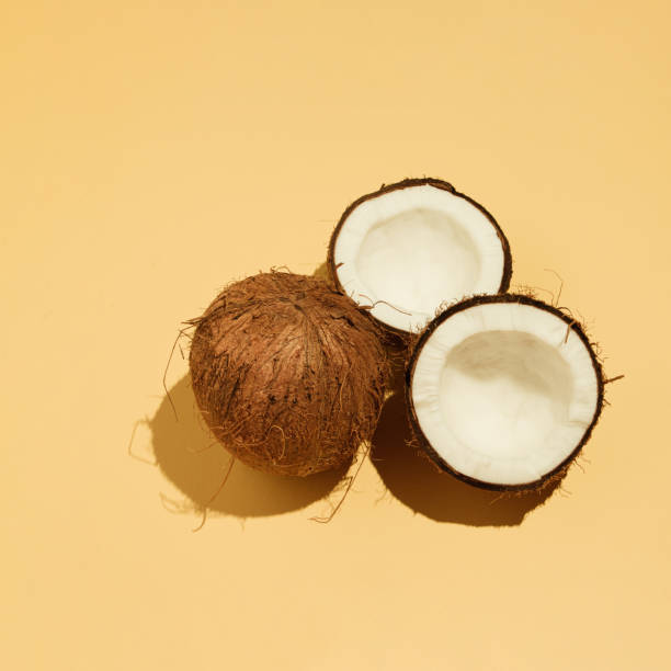 istock Coconut and two halves, on a yellow background, summer 1328550805