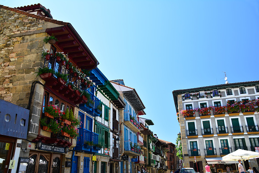 Hondarribia, Basque Country, Spain - August 6, 2020: typical houses with their colorful balconies in the Plaza de Armas.