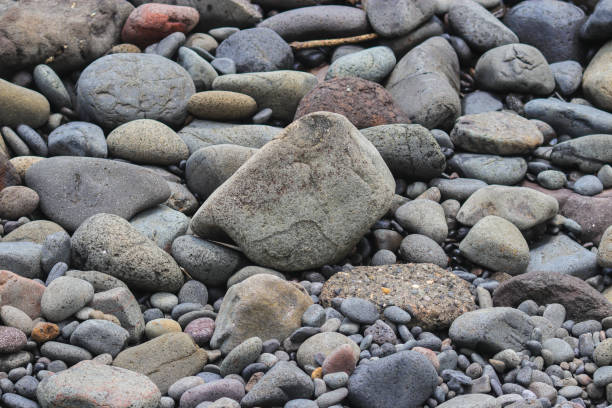 istock Beach stones and pebble texture for industrial background 1328553864