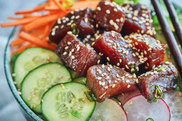 istock Preparing Ahi Tuna with Cucumber, Radish, Carrots and Avocado 1328555807