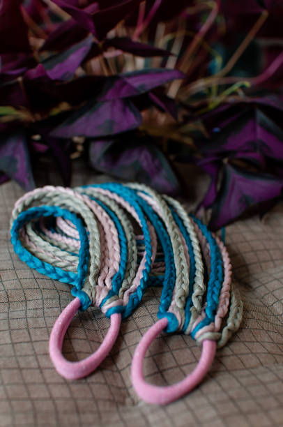 istock Colored braids made of pink and blue artificial hair 1328558280