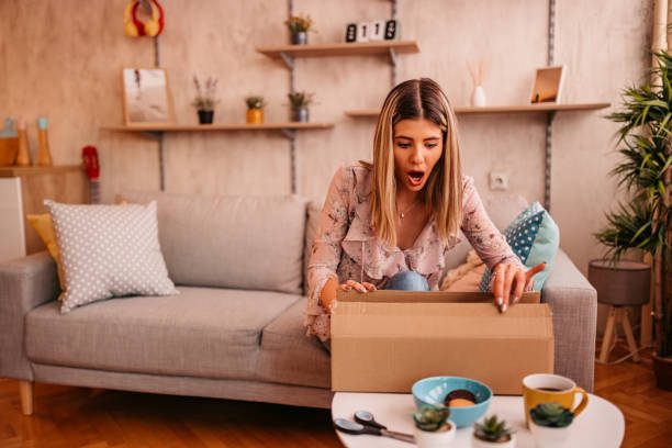 istock Woman customer opening cardboard box parcel 1328560301