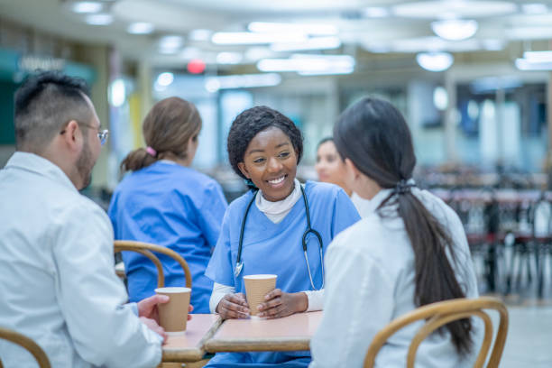 istock Diverse medical team discussing over lunch 1328560988