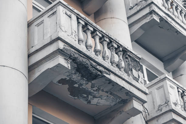 dilapidated balcony in an old house, a stone fell from the balcony