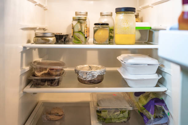 istock Refrigerator Shelves with Jars, Packaged Food and Take Out Boxes 1328563799