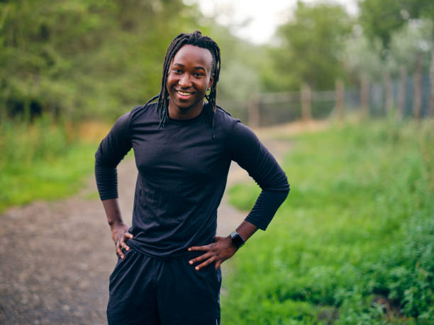 istock Young Man Preparing to Go on a Run Outdoors 1328566663