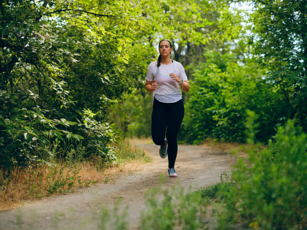 istock Woman Runner on a Trail 1328566745