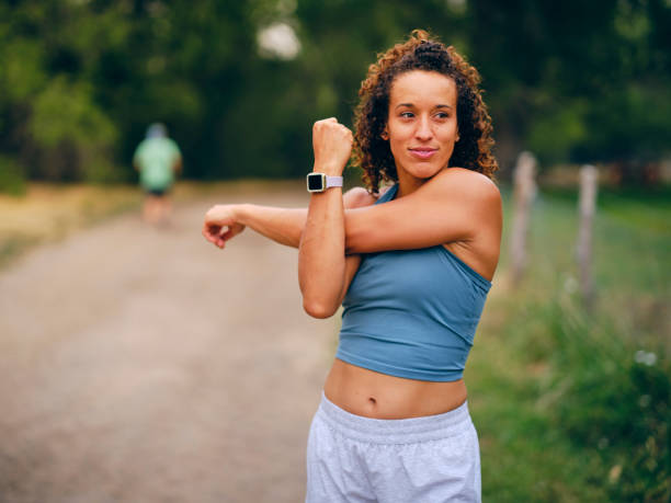 istock Woman Athlete Stretching Before Running 1328566900