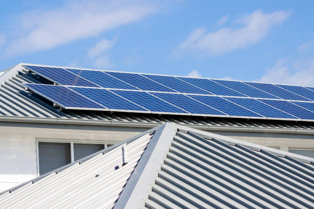 New house corrugated iron roof with solar pannels, background with copy space New house corrugated iron roof with solar panels, background with copy space, full frame horizontal composition house solar pannels stock pictures, royalty-free photos & images