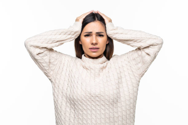 istock Young woman disappointed hands on head isolated on white background 1328570622