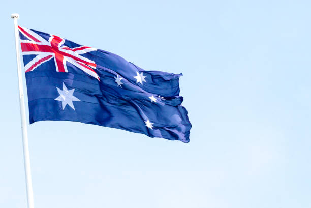 istock Australian flag,sky background with copy sapce 1328577365