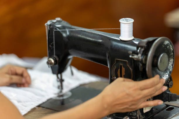 istock woman's hands Neat tailor sewing a fabric service Fashion Designer Working 1328577559