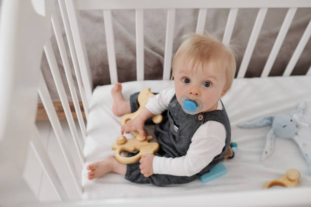 istock Baby Playing With Toy 1328579439