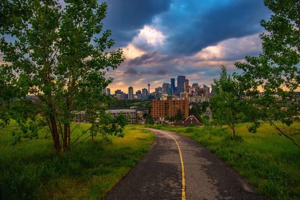 istock Cloudy Sunrise Sky Over A Park Road Leading Towards Downtown Calgary 1328580281