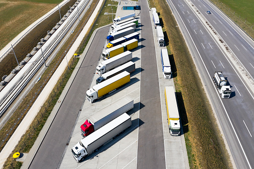 Rows of trucks in the parking lot, aerial top view.