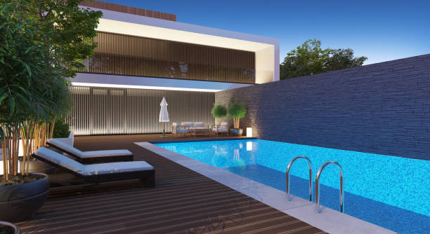 istock Modern Luxurious Villa with garden and swimming pool. Night scene. 1328582100