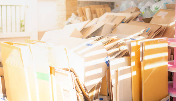 istock Stack of old-use cardboard boxes and ready to be sent for recycling at the warehouse. 1328585102