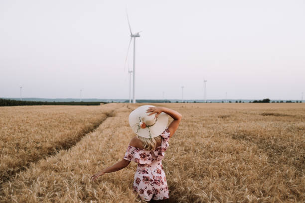 istock young woman in wheat field 1328585240