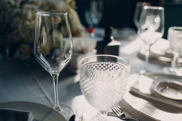 istock beautiful shape empty wine glass on table in restaurant decor 1328586918