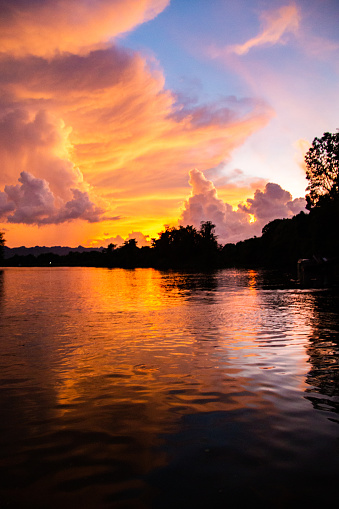 Sunset on Kanchanaburi River Khwae Yai in Thailand. High quality photo