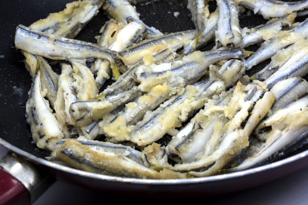 istock Fried fish in pan. Fasting food on dark background 1328595637