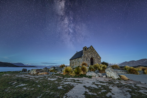 Famous Church of the Good Shepherd under the Milky Way at Lake Tekapo New Zealand. Situated on the shore of Lake Takapō, the Church of the Good Shepherd was built to the glory of God and as a memorial to the pioneers of the Mackenzie Country. Good Shepherd's Chapel Night Sky View. Church of the Good Shephard, Lake Tekapo, Tekapo, South Island, New Zealand, Oceania