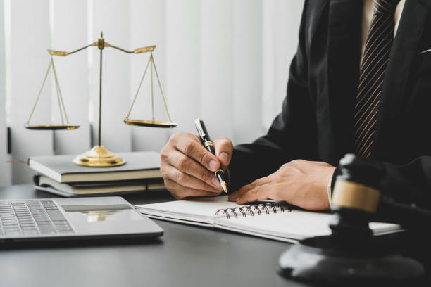 attorneys or judges sitting at work to sign important documents, attorneys and law, legal concepts of the judiciary and the legislature. - lei imagens e fotografias de stock