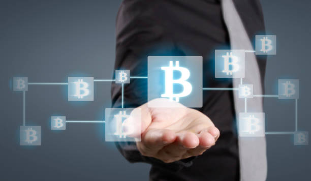 istock Hands showing bitcoin as virtual money on digital 1328608999