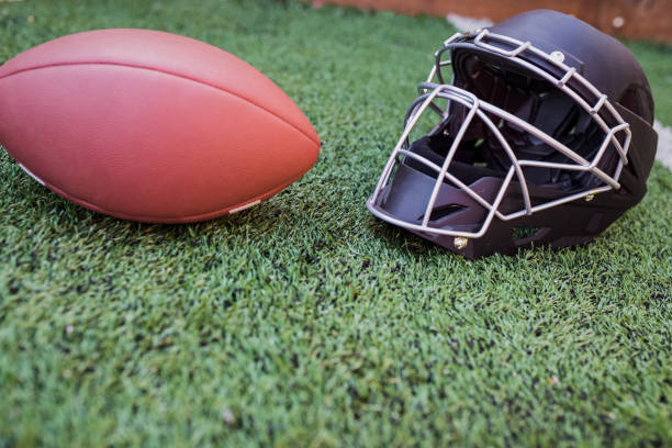 istock Football Helmet on Field 1328610722