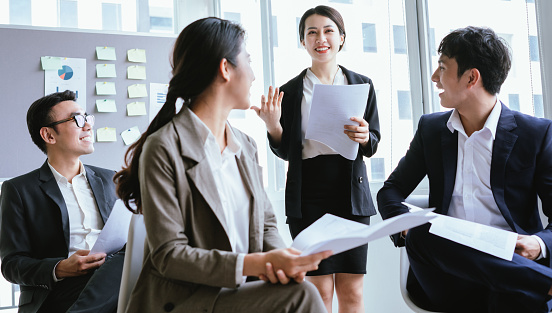 Portrait of Asian businesswoman presenting her plan in a meeting