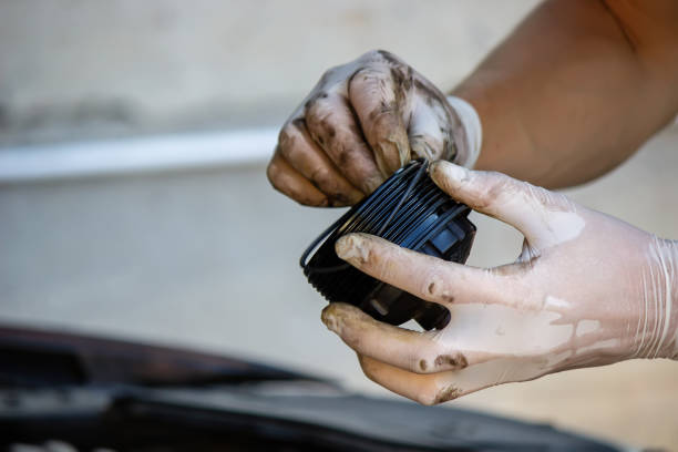 replacing the oil filter on the car. replacing the oil filter on the car. Selective focus gasket stock pictures, royalty-free photos & images