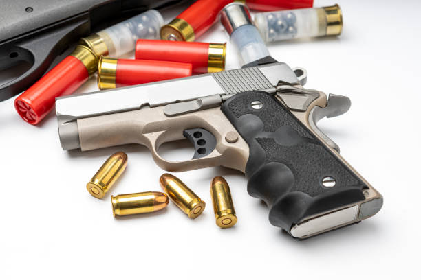 istock Automatic handgun and shotgun bullets on white background 1328612844